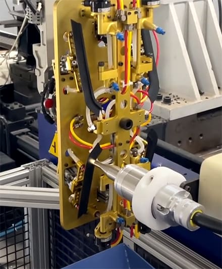 champion-bi125-treating-tpv-part Champion Plastics uses plasma to treat part for better adhesive bonds.