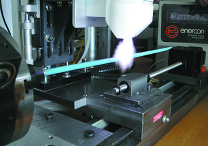 The plasma system prepares medical devices for printing.
