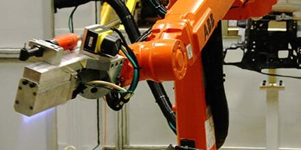 Robot with Flame Treater treats dashboard.