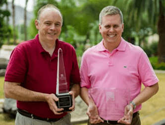 Enercon's Ryan Schuelke and Tom Wajda of Unilever with Package of the Year awards.