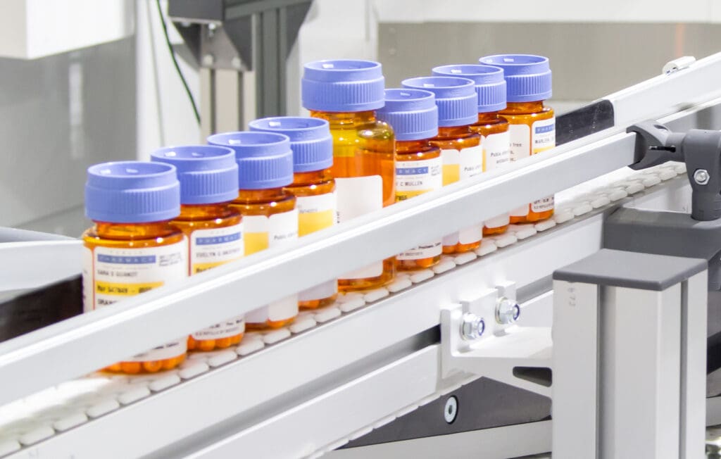 innovation-mail-order-pharmacueticals-bottles innovation pharmaceutical bottles being conveyed
