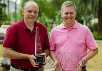 Enercon's Ryan Schuelke and Tom Wajda of Unilever with Package of the Year awards.