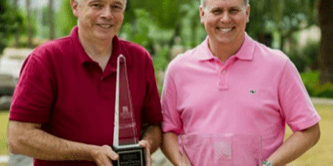 Enercon's Ryan Schuelke and Tom Wajda of Unilever with Package of the Year awards.