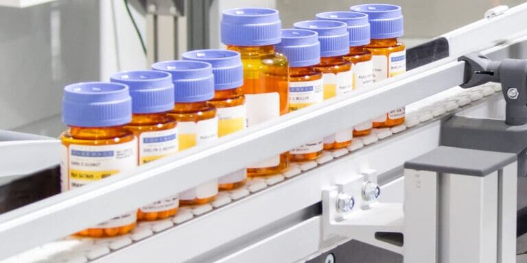 innovation pharmaceutical bottles being conveyed