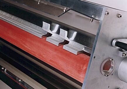 Silicone sleeves, shown here, are the most common roll covering for surface treating systems.